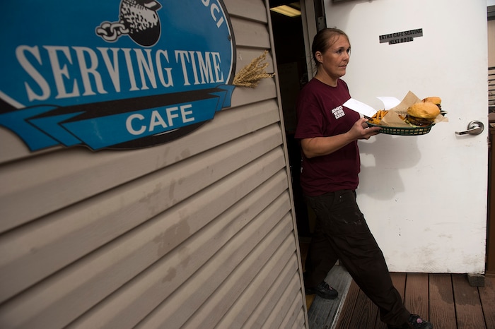 (Leah Hogsten  |  The Salt Lake Tribune) Brittney Christensen, 35, serves food to customers as her latest batch of chocolate mint brownies from scratch bakes in the oven. Every Monday through Friday, a half-dozen or so Level 4 inmates file out of the Olympus Facility at the Utah State Prison to cook, bake and serve the public at the Serving Time Caf. The operation is part of Utah Department of Corrections Industries (UCI) and is aimed at helping inmates return to society.