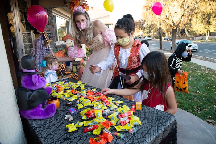 (Francisco Kjolseth  |  The Salt Lake Tribune) Houses sign up to participate in the SugarHood Halloween treat giving or a visual scavenger hunt as participants agree to abide by CDC Covid safety standards as they encourage children to touch only what is taken, keep their distance from others and wear masks while trick or treading on Saturday, Oct. 31, 2020.
