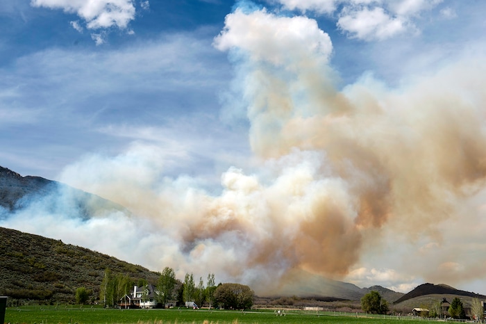 (Rick Egan  |  The Salt Lake Tribune)   A fire burns near Dutch Canyon Road in Midway, 
Tuesday May 12, 2020