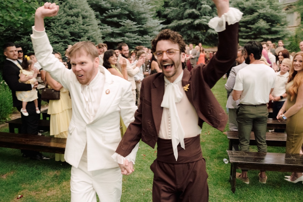 (Gabriel Conover) Grooms Blake Hogge, left, and Trystan Nickovich celebrate after their wedding ceremony on Friday, June 26, 2026