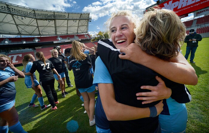 (Scott Sommerdorf | The Salt Lake Tribune)
Samantha Tippetts hugs her coach Sharron Wood after Sky View defeated Bonneville 2-0 to win the 4A title game, Saturday, October 21, 2017.