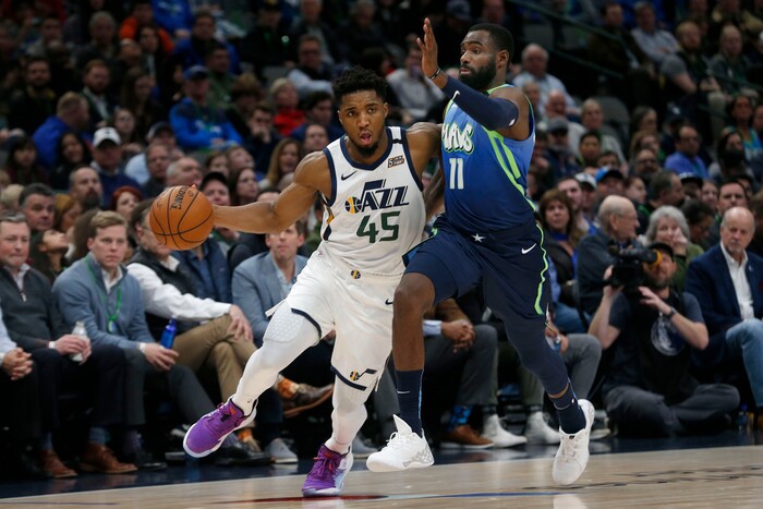 Utah Jazz guard Donovan Mitchell (45) tries to get past Dallas Mavericks guard Tim Hardaway Jr. (11) during the second half an NBA basketball game in Dallas, Monday, Feb. 10, 2020. Utah defeated Dallas 123-119. (AP Photo/Michael Ainsworth)