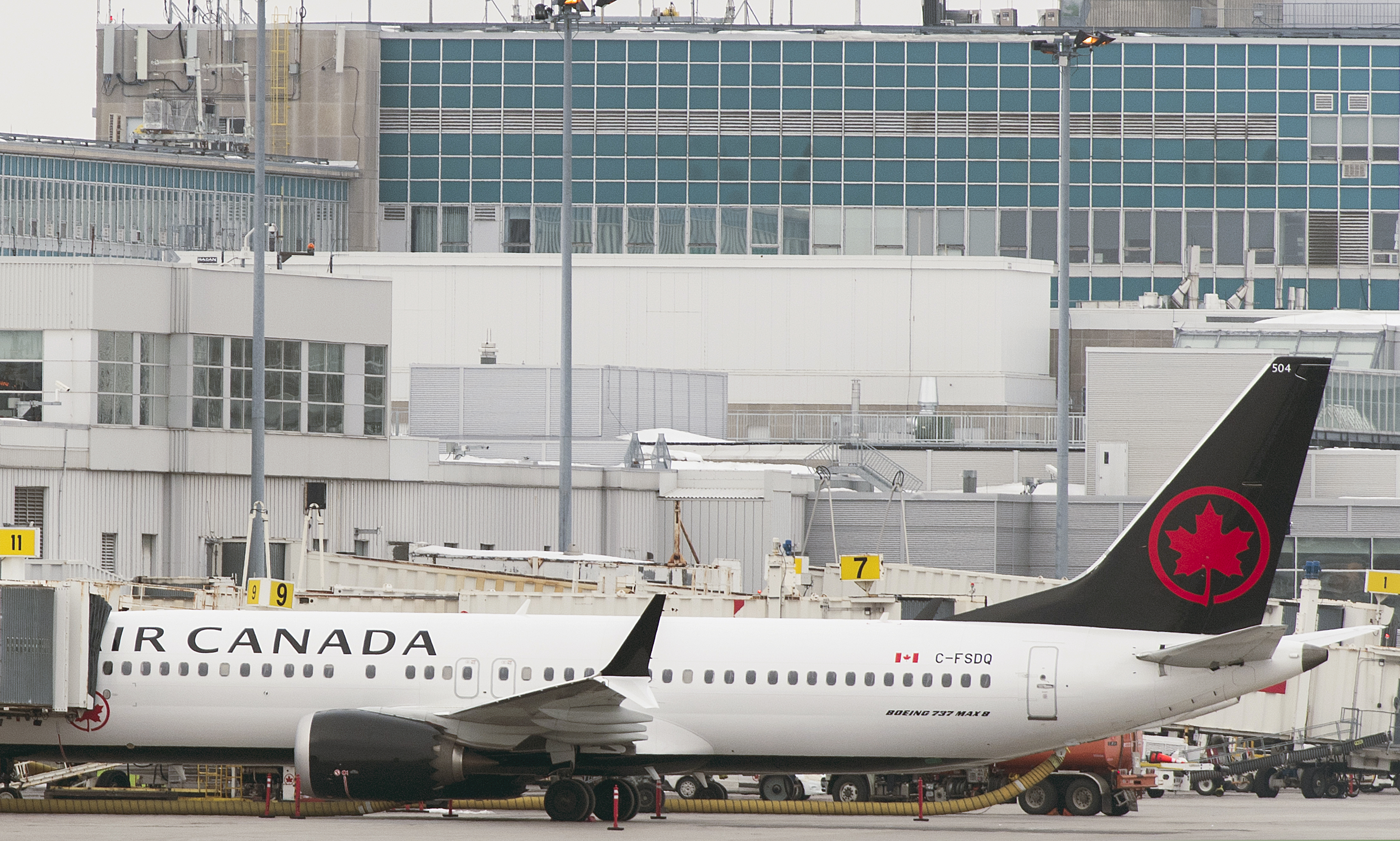 (Graham Hughes | The Canadian Press | The Associated Press) An Air Canada Boeing 737 Max 8 aircraft is parked next to a gate at Trudeau Airport in Montreal, Wednesday, March 13, 2019. Canada's transport minister says the country is closing air space to the Boeing 737 Max 8 jet following the crash of an Ethiopian Airlines jetliner.
