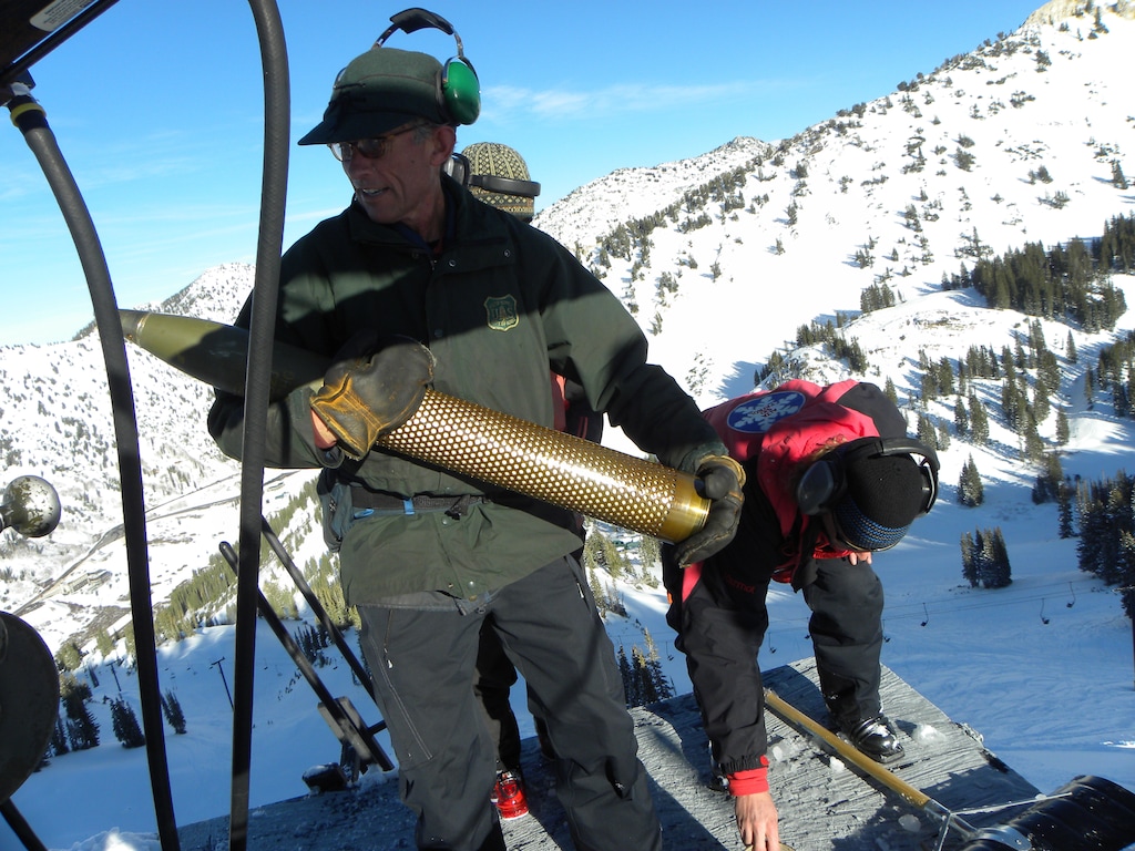 (Photo courtesy of Alta Ski Area) Former Alta General Manager Onno Wieringa carries the kind of howitzer shell used to control avalanches at the Little Cottonwood Canyon resort. The resort looked for other ways to control snow slides as military hardware got older and harder to find, and now is proposing a tram to help staff perform avalanche control.