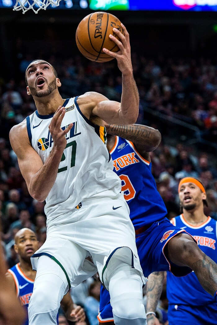 (Chris Detrick  |  The Salt Lake Tribune)  Utah Jazz center Rudy Gobert (27) shoots past New York Knicks center Kyle O'Quinn (9) during the game at Vivint Smart Home Arena Friday, January 19, 2018.  
