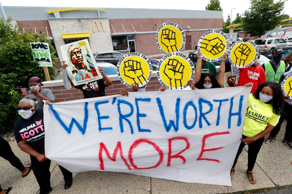 (Paul Sancya | AP)  Protesters rally outside a McDonald's in Detroit, Monday, July 20, 2020. The national workers strike saw people walk off the job Monday in U.S. cities to protest systemic racism and economic inequality.