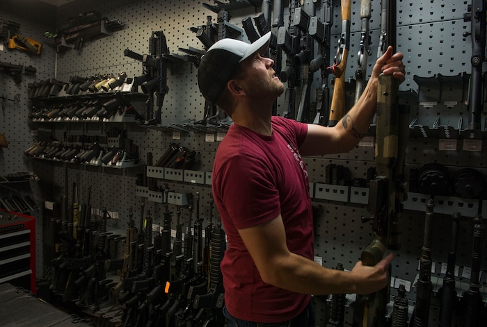 Leah Hogsten | The Salt Lake Tribune
Silencerco's public relations specialist Matt Pinnell pulls down a big bore rifle used for hunting to show Silencerco's Harvester 338 silencer. Silencerco is one of the country's largest manufacturers of silencer for guns of all kinds, Friday, May 28, 2017.