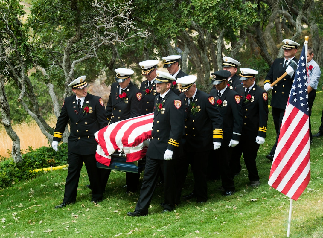 (Rick Egan  |  The Salt Lake Tribune)  Matthew Burchett is carried by the pall bearers at East Lawn Memorial Hills Cemetery in Provo, Monday, Aug. 20, 2018.