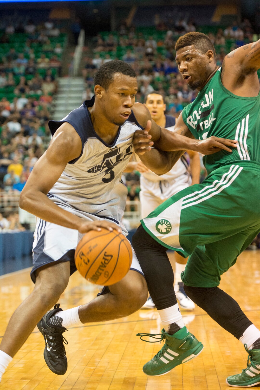 Rick Egan  |  The Salt Lake TribuneUtah Jazz guard Rodney Hood (5) takes the ball inside as Boston Celtics guard Marcus Smart (36) defends, in Utah Jazz Summer League action, Utah Jazz vs. The Boston Celtics, at EnergySolutions Arena, Monday, July 6, 2015.