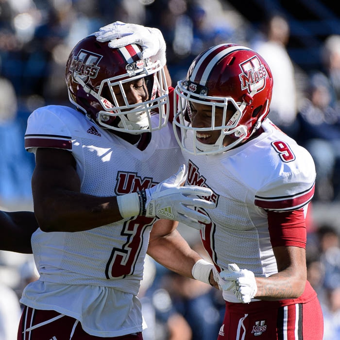 (Trent Nelson | The Salt Lake Tribune)  Massachusetts Minutemen cornerback Lee Moses (3) and Massachusetts Minutemen cornerback Isaiah Rodgers (9) celebrate an interception by Moses as BYU hosts the University of Massachusetts, NCAA football in Provo, Saturday November 18, 2017.