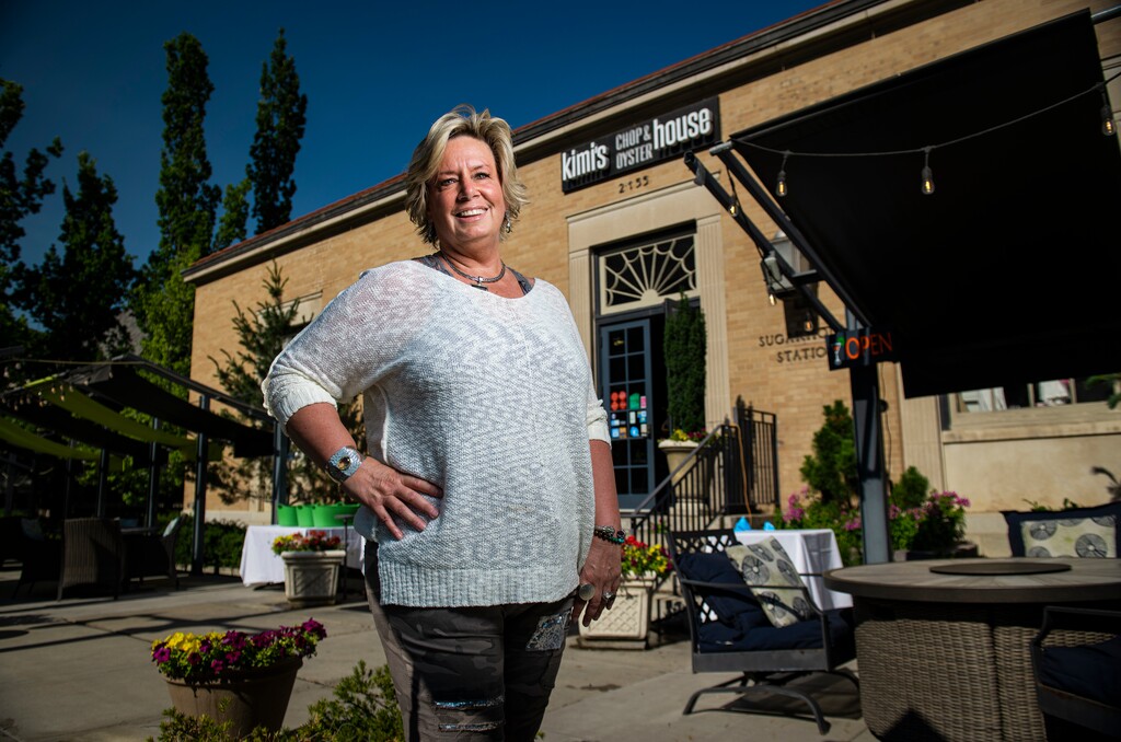 (Isaac Hale | Special to The Tribune) Kimi Eklund, owner of Kimi’s Chop and Oyster House, poses for a portrait in front of her restaurant in Sugar House on Friday, July 9, 2021.
