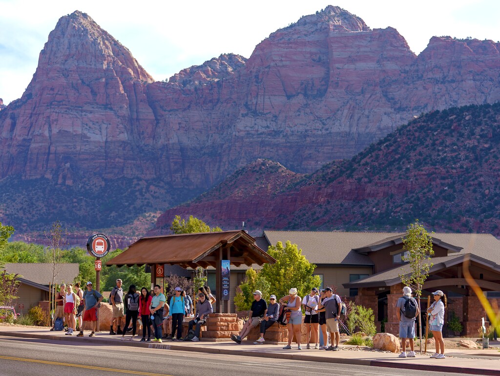 (Leah Hogsten | The Salt Lake Tribune) Mornings in Springdale, just outside the entrance to Zion National Park are a flurry of activity as hikers rush to board city shuttles to take them into the park, Sept. 26, 2021. Springdale, population 529, sees about 16,000 tourists a day.