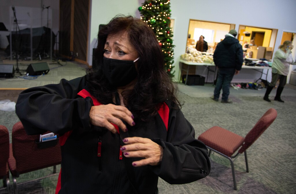 (Francisco Kjolseth | The Salt Lake Tribune) Latina activist Josie Valdez, visits the Discovery Church food pantry in Murray on Tuesday, Dec, 22, 2020, as she tries to check in with Utah Latinos who still tend to stay underground despite President-elect Joe Biden's win, worrying that President Donald Trump may yet find a way to stay in office. Valdez who as an observer has seen fewer Latinos and immigrants in public because of lingering fear of Trump policies and rhetoric, urges community members: “Don’t experience hunger because you are afraid.”