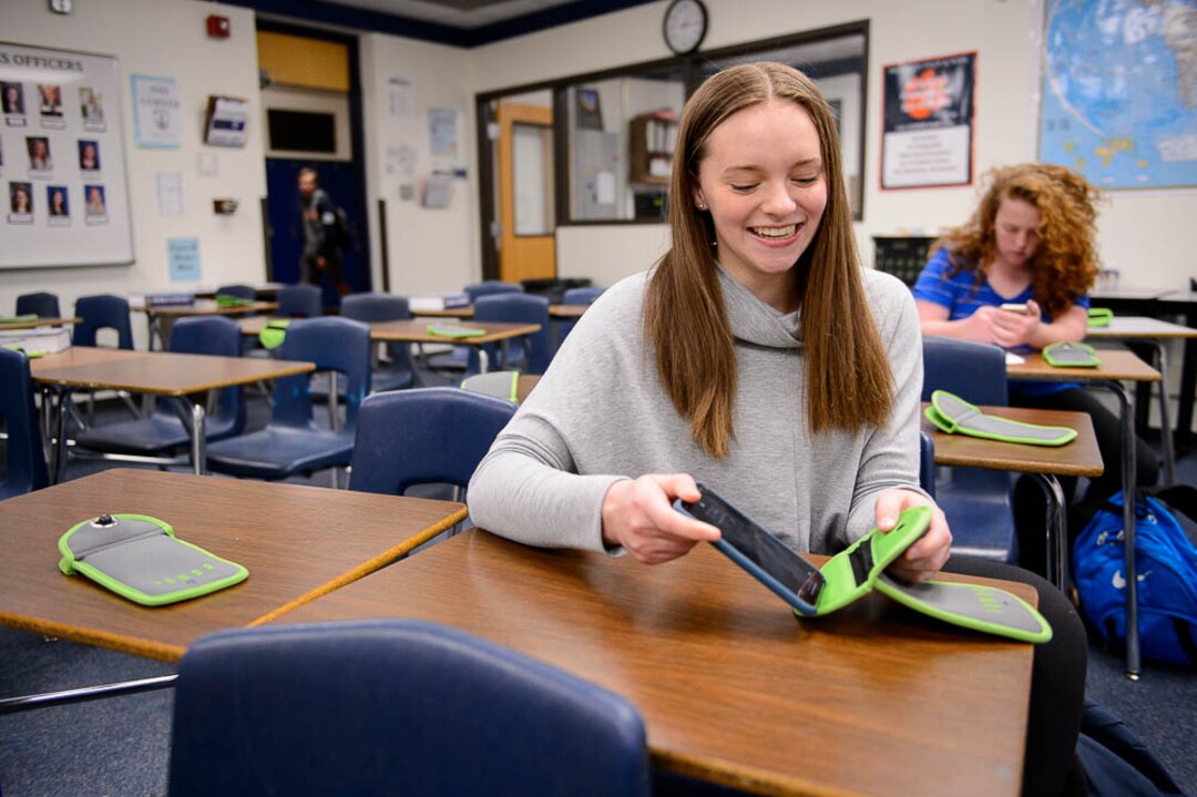 (Trent Nelson | The Salt Lake Tribune) Sammi Snyder, a student in Monta Thomas' class at Brighton High School in Cottonwood Heights, secures her cellphone in a locking pouch made by the company Yondr.