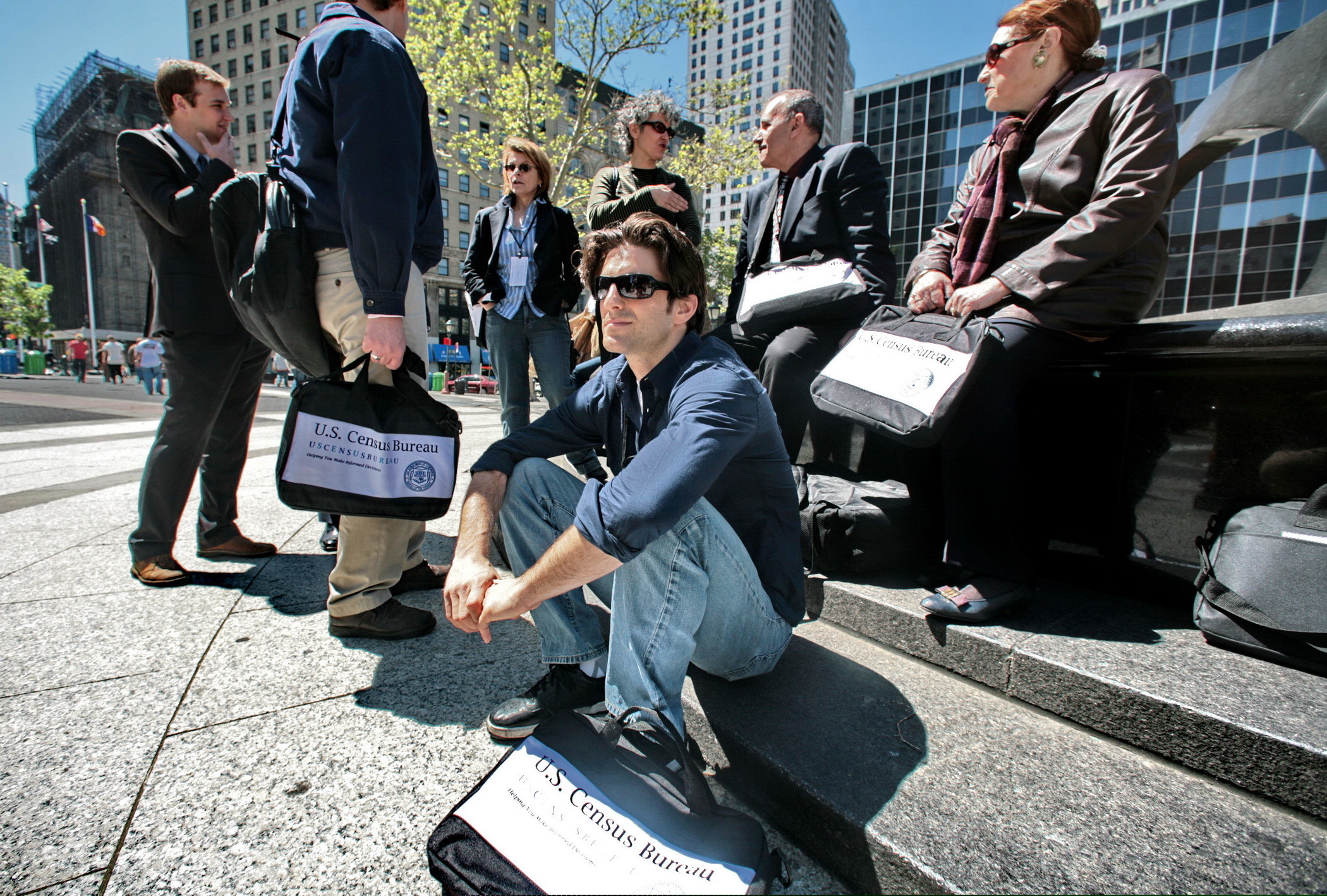(AP Photo/Bebeto Matthews, File) In this April 29, 2010 file photo, census employees, including Joseph Mintz, seated, and Lesley Rubinger, far right, assemble after a training course in New York. A federal judge blocked the Trump administration Tuesday, Jan. 15, 2019, from asking about citizenship status on the 2020 census, the first major ruling in cases contending that officials ramrodded the question through for Republican political purposes to intentionally undercount immigrants.