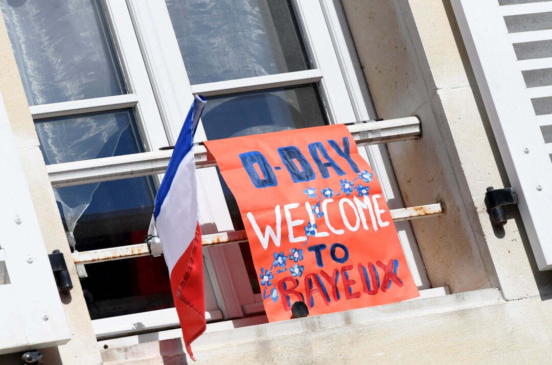 (Bertrand Guay/ POOL via AP) A placard is seen outside a window in front of the Cathedral of Bayeux, Normandy, Thursday June 6, 2019, as part of D-Day commemorations marking the 75th anniversary of the World War II Allied landings in Normandy.