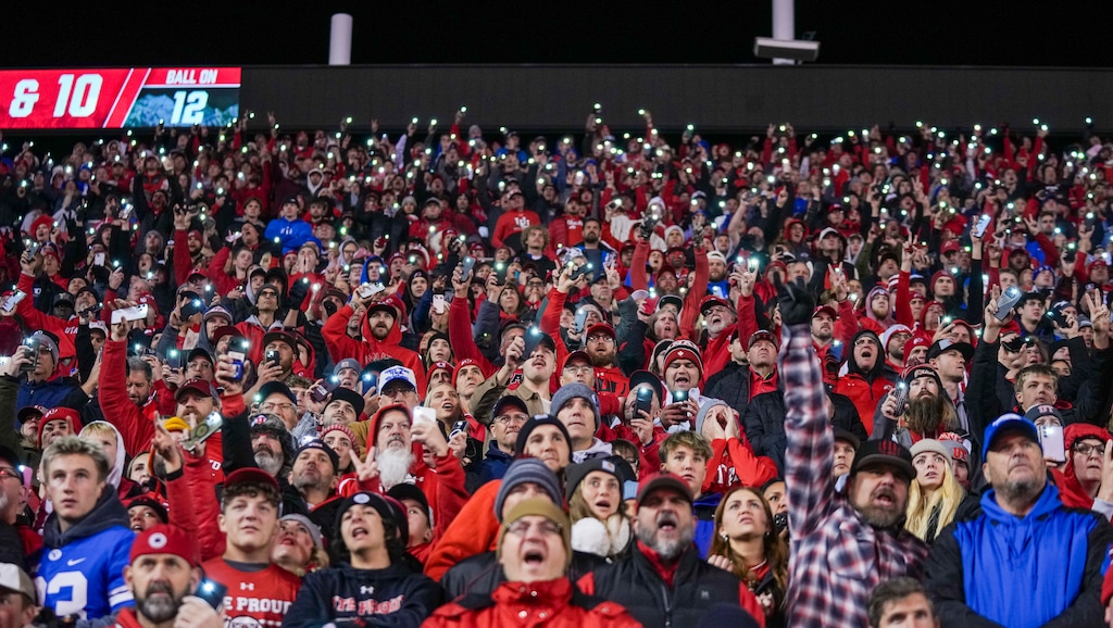 (Bethany Baker | The Salt Lake Tribune) Fans stand and hold up the light on their cellphones between the third and fourth quarters of the game between the Utah Utes and the Brigham Young Cougars at Rice-Eccles Stadium in Salt Lake City on Sunday, Nov. 10, 2024.