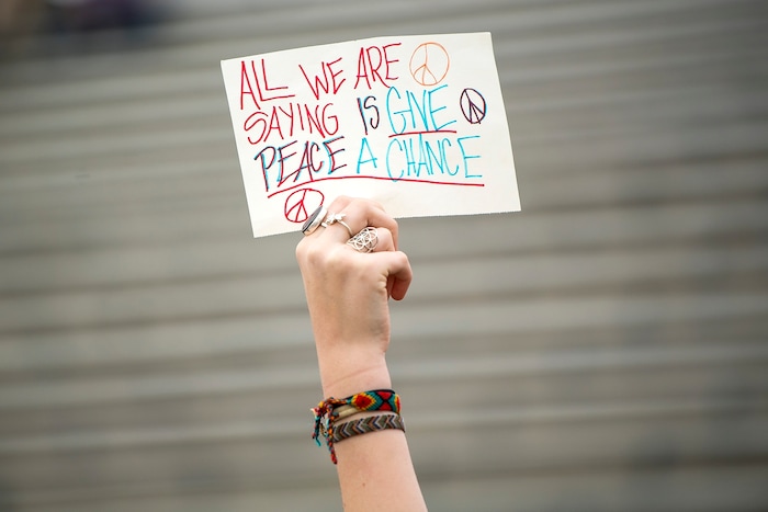 (Chris Detrick  |  The Salt Lake Tribune)  Senior Zina Runyan participates in a nationwide demonstration for better gun safety laws at Highland High School in Salt Lake City Thursday, March 15, 2018. Students at more than 30 schools along the Wasatch Front, nearly all of them high schools, particiapted in the 17-minute walkout Ñ one minute for each of the Florida students killed.
