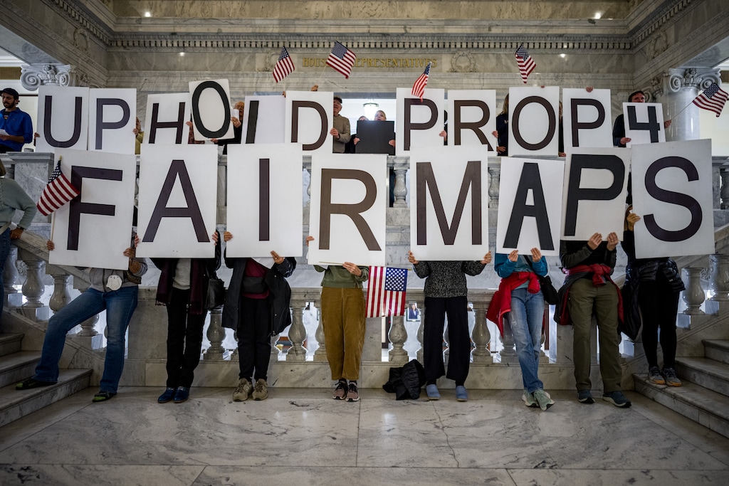(Trent Nelson | The Salt Lake Tribune) People gathered at the state Capitol before a special session in December were encouraged not to sign a Republican-backed petition seeking to repeal Utah's ban on partisan gerrymandering. 