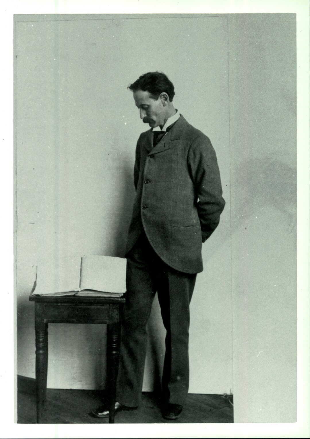 (Courtesy The Church of Jesus Christ of Latter-day Saints)  | George Schweich, stands next to the printer's manuscript of the Book of Mormon, which on Monday was sold to the Church of Jesus Christ of Latter-day Saints.