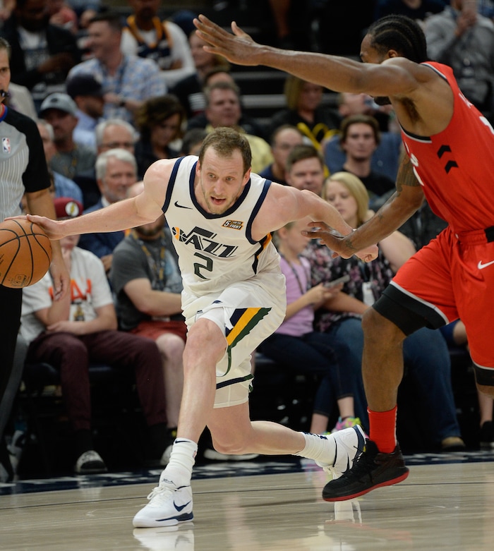 (Francisco Kjolseth  |  The Salt Lake Tribune)  Utah Jazz forward Joe Ingles (2) tries to regain his footing against the Raptors in the first half of the preseason NBA game at Vivint Smart Home Arena Tuesday, Oct. 2, 2018, in Salt Lake City.