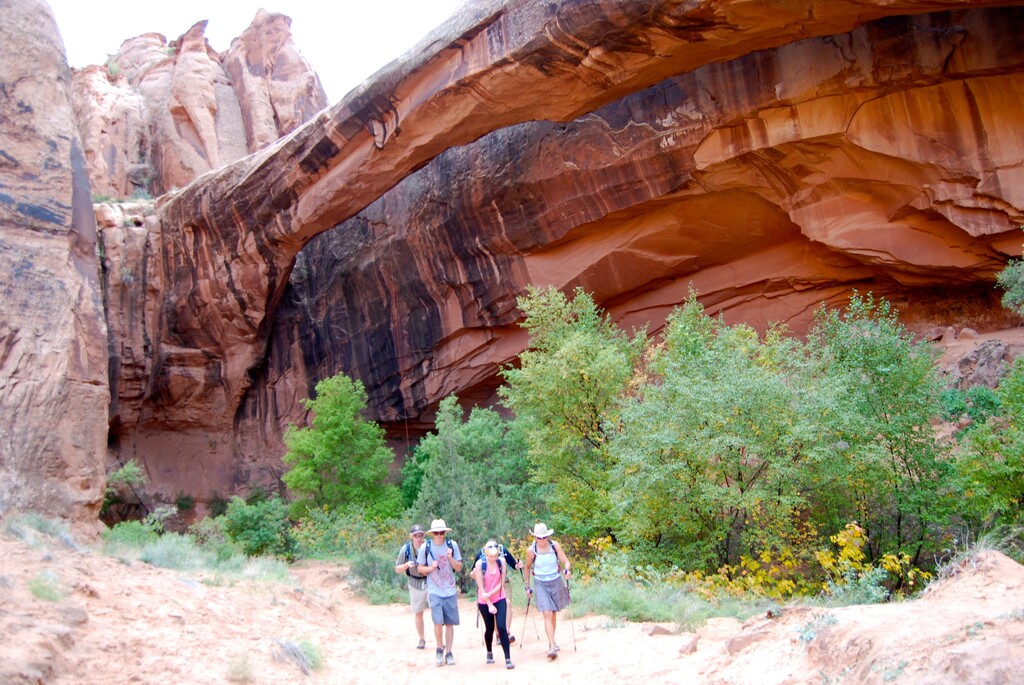 Hikers visit Morning Glory Arch in southern Utah's Negro Bill Canyon. For years, controversy over the canyon's racial name has dogged Grand County, which is now proposing changing the name to Grandstaff in honor of the canyon's namesake pioneer William Grandstaff, a former Southern slave turned Western cowboy who prospected near Moab in the late 1870s. Photo by Brian Maffly