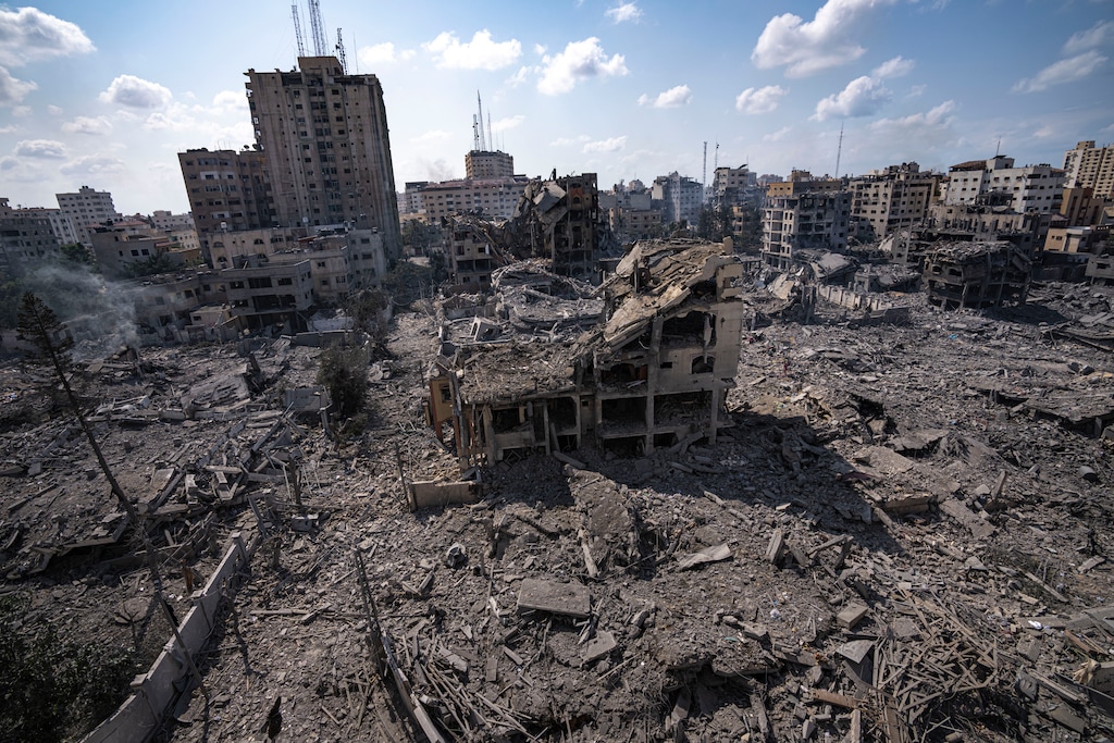(Fatima Shbair | AP) A view of the rubble of buildings hit by an Israeli airstrike, in Gaza City, Tuesday, Oct. 10, 2023. Israel has launched intense airstrikes in Gaza after the territory's militant rulers carried out an unprecedented attack on Israel Saturday, killing over 900 people and taking captives. Hundreds of Palestinians have been killed in the airstrikes.