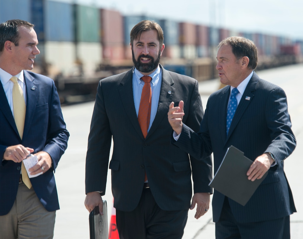 (Rick Egan  |  The Salt Lake Tribune)   Clint Schelbitski Union Pacific vice-president, public affairs, Nathan Anderson, Union Pacific director of public relations and Gov. Gary Herbert walk to a news conference at the Union Pacific Intermodal Facility, Thursday, Aug. 16, 2018.