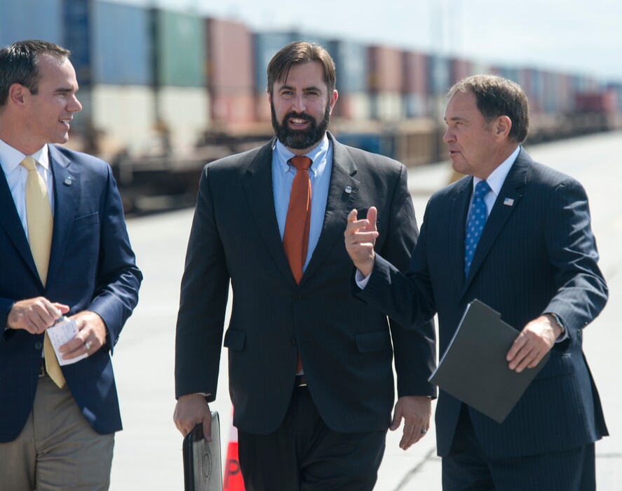(Rick Egan  |  The Salt Lake Tribune)   Clint Schelbitski Union Pacific vice-president, public affairs, Nathan Anderson, Union Pacific director of public relations and Gov. Gary Herbert walk to a news conference at the Union Pacific Intermodal Facility, Thursday, Aug. 16, 2018.