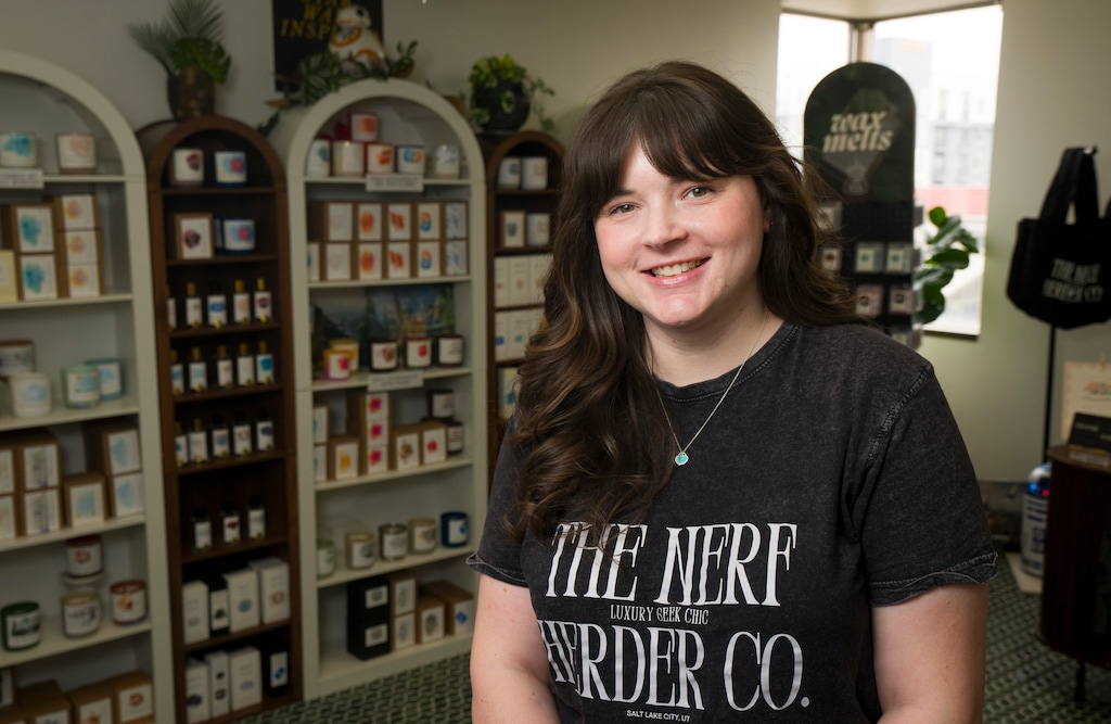 (Bethany Baker  |  The Salt Lake Tribune) Owner Melissa Nagata stands in her storefront for Nerf Herder Co., a candle shop specializing in candles inspired by book characters and famous fandoms, in Midvale on Monday, March 23, 2026.