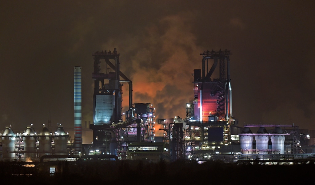 (Martin Meissner | The Associated Press) The Nov. 19, 2014 file photo shows two furnaces at the ThyssenKrupp steel plant in Duisburg. A new facility scheduled to open in April 2018 will cut down 10 million tons of CO2 emissions a year.