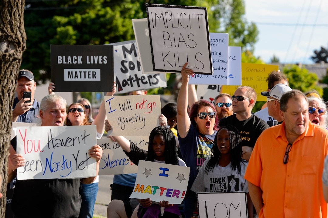 (Trent Nelson  |  The Salt Lake Tribune)A protest organized by Black Lives Matter and other groups at the Woods Cross Police Department on Friday June 14, 2019. The rally was to show support for DJ Hrubes, a 10-year-old black child who was held at gunpoint by a police officer last week while playing in his grandmother's front yard.