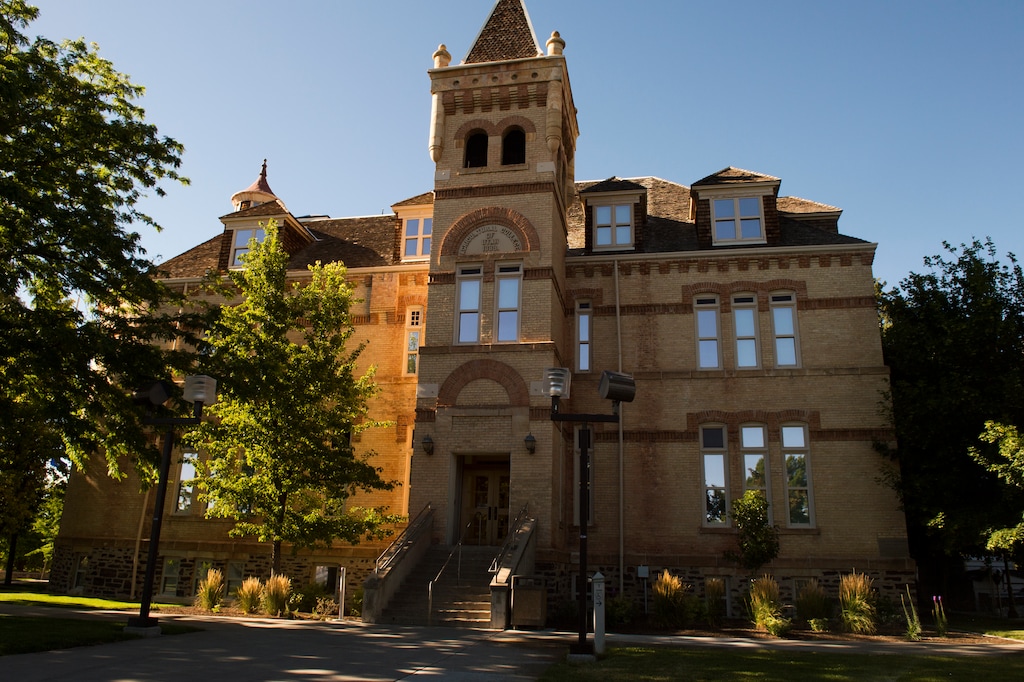 (Leah Hogsten  |  The Salt Lake Tribune) The Old Main Building at Utah State University. A former USU football player was ordered Tuesday to spend around seven months in jail after he admitted to sexually assaulting a sleeping woman in her bed.