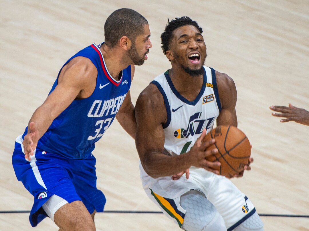 (Rick Egan | The Salt Lake Tribune) Utah Jazz guard Donovan Mitchell (45), gets past LA Clippers guard, Nicolas Batum (33), in NBA action between the Utah Jazz and the LA Clippers at Vivint Arena, on Friday, Jan. 1, 2021.