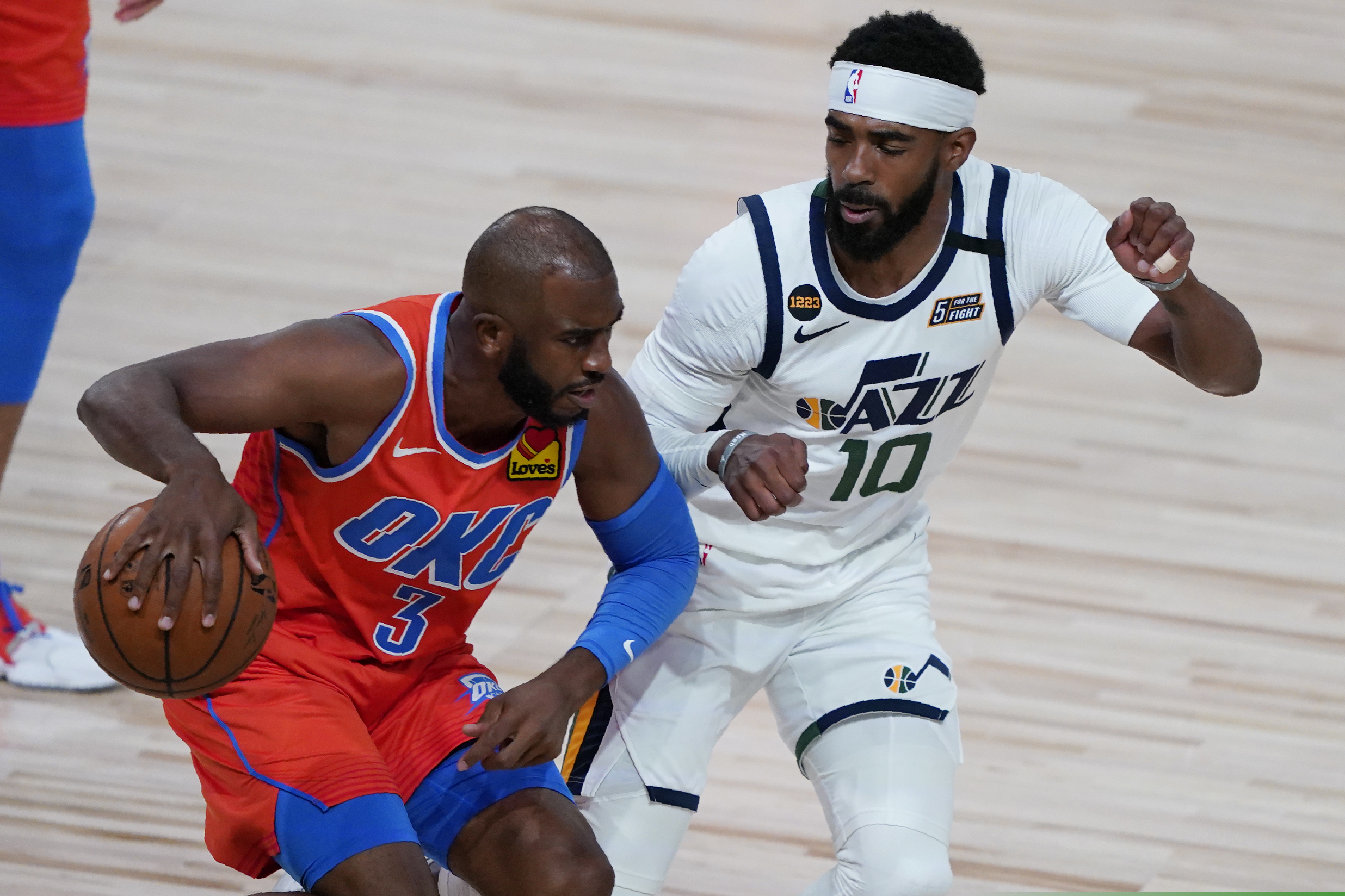 Utah Jazz's Mike Conley (10) guards Oklahoma City Thunder's Chris Paul (3) during the first half of an NBA basketball game Saturday, Aug. 1, 2020, in Lake Buena Vista, Fla. (AP Photo/Ashley Landis, Pool)