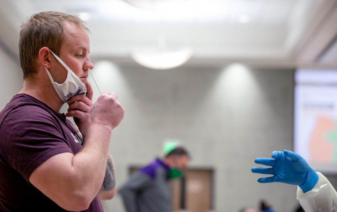 (Photo courtesy of Weber State University) James Bockas self-administers a COVID-19 test as Weber State University begins the first day of wide-scale COVID-19 testing for students and employees at the Ogden campus on Tuesday, November 10, 2020. Weber State had previously offered free testing for anyone with possible coronavirus symptoms. The new process will allow for free rapid testing for thousands of people even if they aren't showing symptoms.