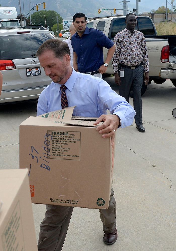 (Al Hartmann | The Salt Lake Tribune)
Rep. Chris Stewart unloads school supplies from his truck donated by citizens from his district for refugee students at Salt Lake Community College's Medowbrook campus in South Salt Lake Tuesday August 22. He later hosted a roundtable discussion with local refugees.