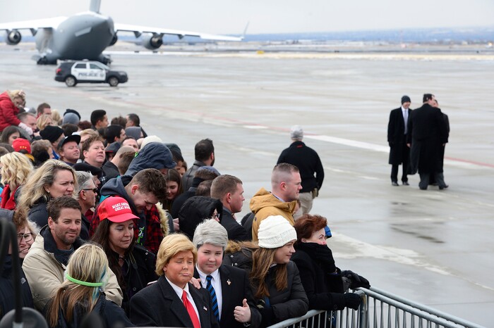 (Scott Sommerdorf   |  The Salt Lake Tribune)   Two young boys dressed as Trump waited for the arrival of Air Force One at the Ronald R Wright National Air Guard Base, Monday, December 4, 2017.  