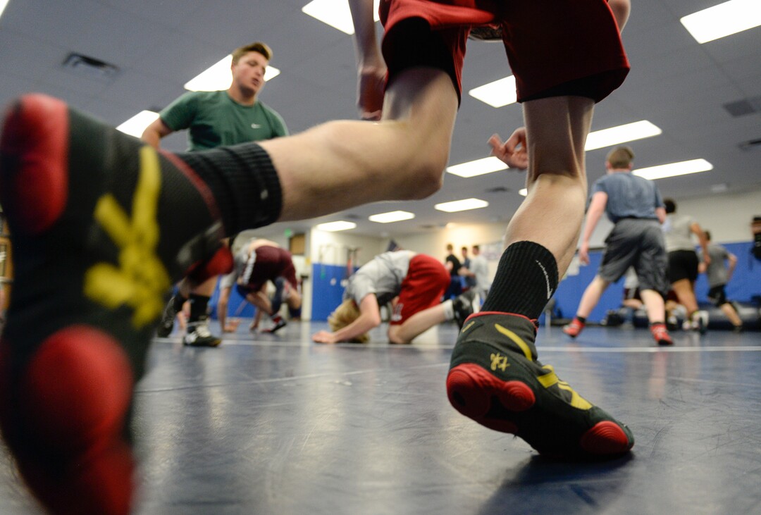 (Francisco Kjolseth  |  The Salt Lake Tribune)  Olympic wrestling champion Rulon Gardner runs an introductory clinic with young wrestlers at Herriman High School after being introduced as the new coach on Wed. May 17, 2018, as they get ready with their warm up exercises. 