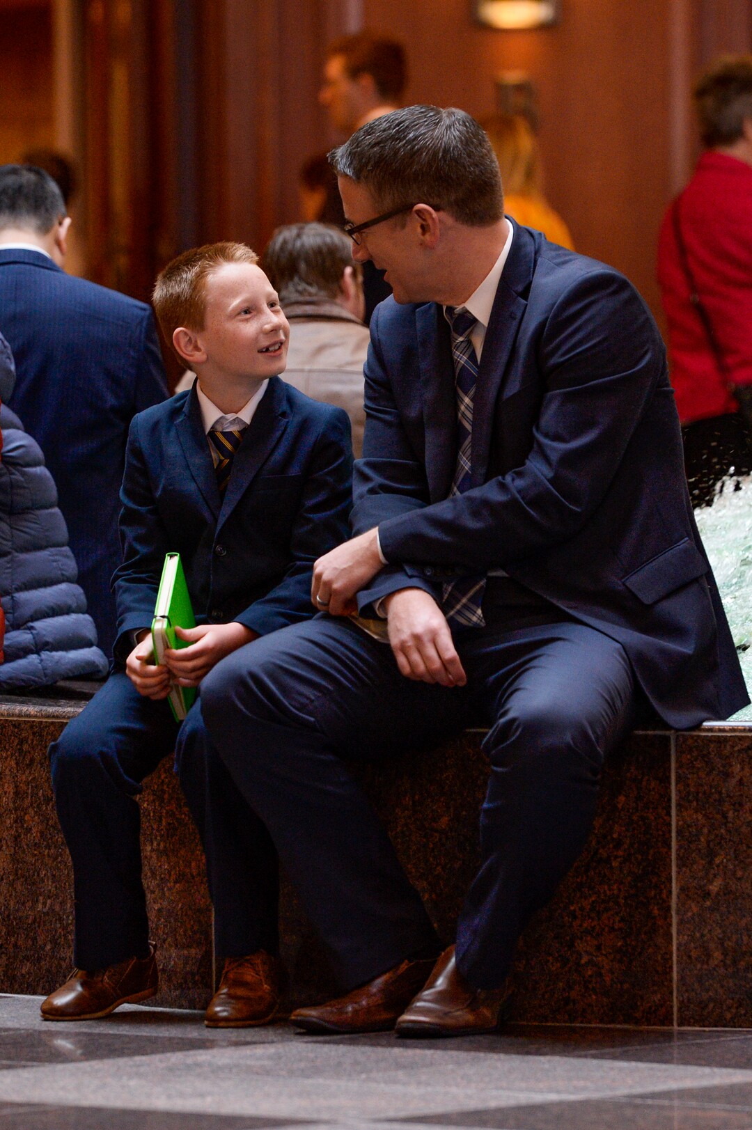 (Leah Hogsten  |  The Salt Lake Tribune_  l-r Benson Bowers. 8, from American Fork attends his first General Conference with his father, Brian Bowers, during the morning session of The Church of Jesus Christ of Latter-day Saints 189th Annual General Conference in Salt Lake City.