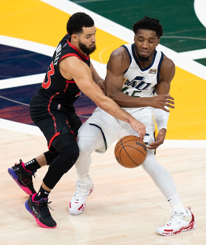 (Rick Egan | The Salt Lake Tribune) Toronto Raptors guard Fred VanVleet (23) is called for a foul as collides with Utah Jazz guard Donovan Mitchell (45), in NBA action between Utah Jazz and Toronto Raptors, at Vivint Arena, in Salt Lake City, on  Thursday, Nov. 18, 2021.
