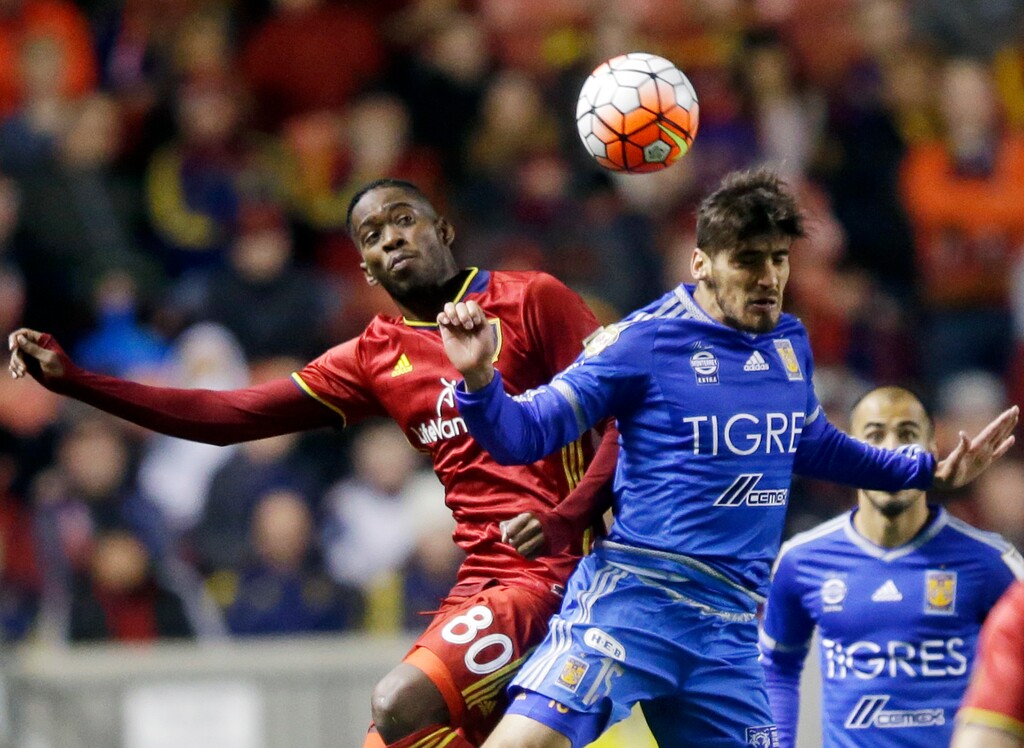 Tigres' Manuel Viniegra (15) and Real Salt Lake forward Olmes Garcia (80) vie for a head ball during the second half in the second leg of a CONCACAF Champions League soccer quarterfinal, Wednesday, March 2, 2016,  in Sandy, Utah. The game ended in a 1-1 draw, and Tigres won on aggregate. (AP Photo/Rick Bowmer)
