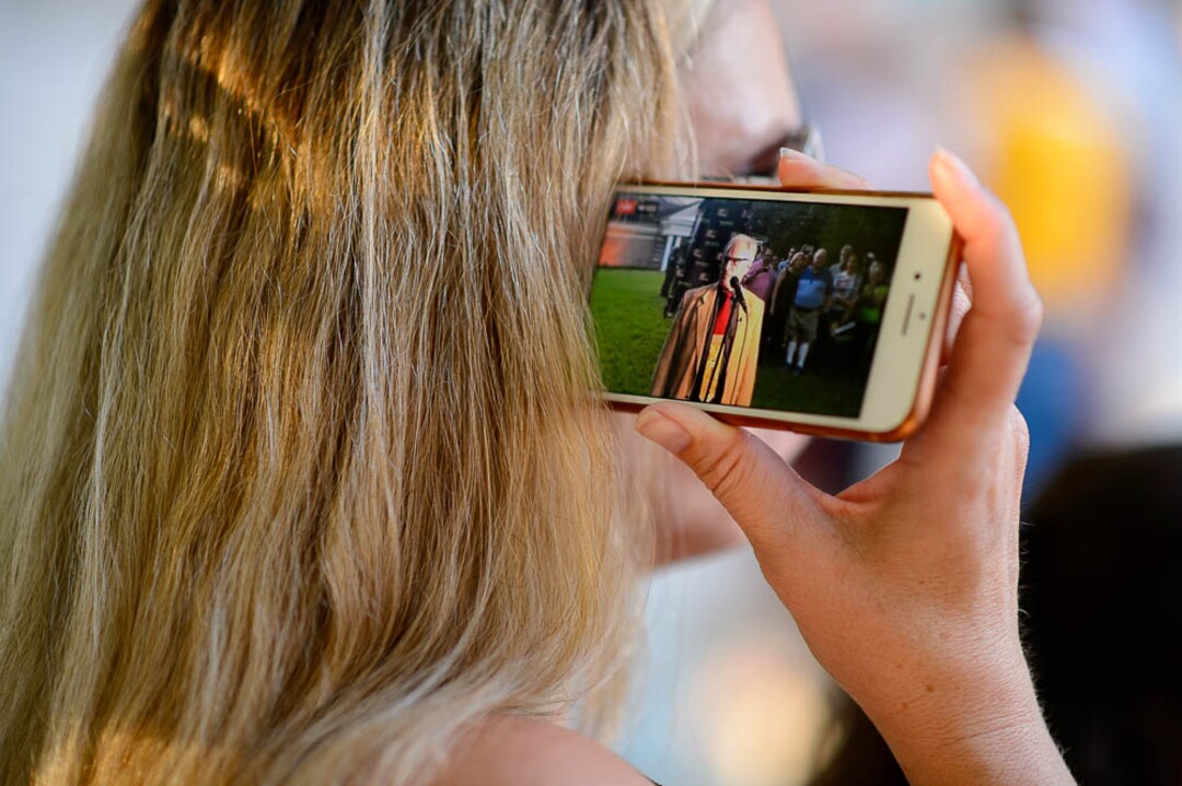 (Trent Nelson | The Salt Lake Tribune)  A woman listens as Sam Young speaks on a livestream after his hearing. People gathered in front of the LDS Church Administration Building Salt Lake City, Sunday Sept. 9, 2018 in support of Sam Young. Young was in a disciplinary hearing tonight after he made calls for changes to the church's youth interview process.