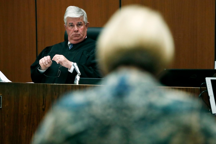 FILE - In this June 9, 2017, file pool photo, Samantha Geimer, foreground, appears before Los Angeles Superior Court Judge Scott Gordon at a motion hearing in Los Angeles. Gordon denied the impassioned plea of Roman Polanski's victim to end the criminal case against the fugitive director. Gordon ruled Friday, Aug. 18, 2017,  Polanski must appear in a Los Angeles court if he expects to have his four-decade-old case resolved. Polanski pleaded guilty to having unlawful sex with Geimer when she was 13. He fled the country on the eve of sentencing in 1978. (Paul Buck/Pool Photo via AP, File)