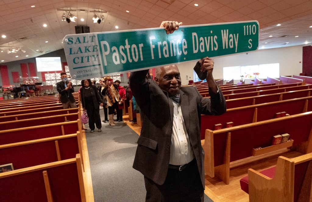 (Francisco Kjolseth | The Salt Lake Tribune) The Rev. France Davis holds his own copy to keep as Salt Lake City leaders, friends and colleagues of the former pastor gathered Thursday, Oct. 28, 2021, at the Calvary Baptist Church in Salt Lake City to celebrate the honorary renaming of a portion of Harvard Avenue to “France Davis Way.”