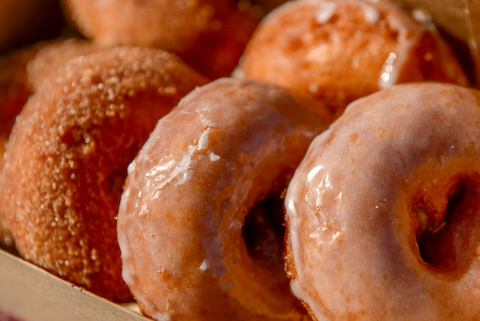Leah Hogsten | The Salt Lake Tribune Sugar coated and glazed apple cider donuts can be found during the 2018 Fall Festival at Cross E Ranch in Salt Lake City, Thursday Oct. 18, 2018.