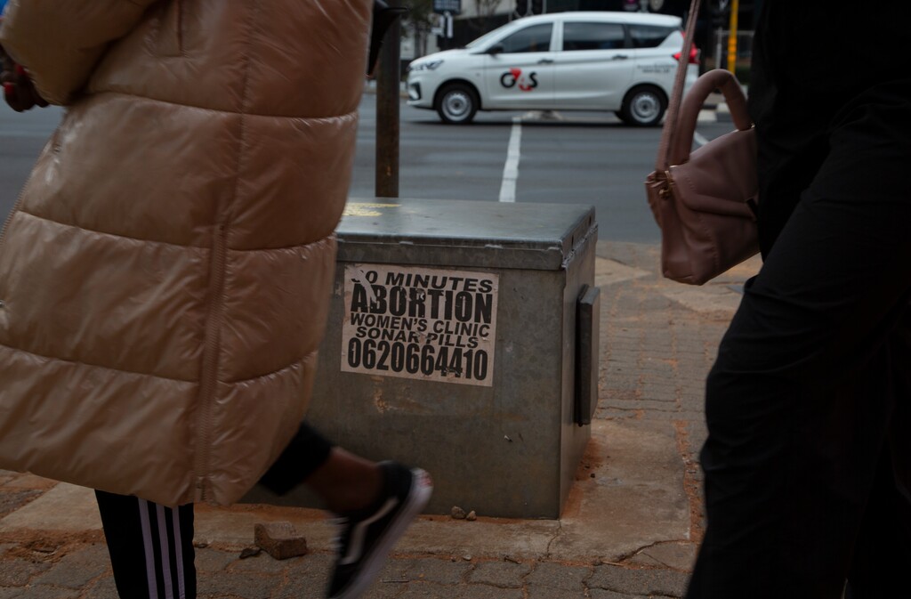 (Denis Farrell | AP Photo) Women pass a sticker advertising abortion pills on a sidewalk in Johannesburg, Wednesday June 28, 2023. When the U.S. Supreme Court overturned the national right to an abortion a year ago, it shook efforts to legalize and make abortions safer in Africa. Sub-Saharan Africa has the world's highest rate of unintended pregnancies, and 77% of abortions are estimated to be unsafe.