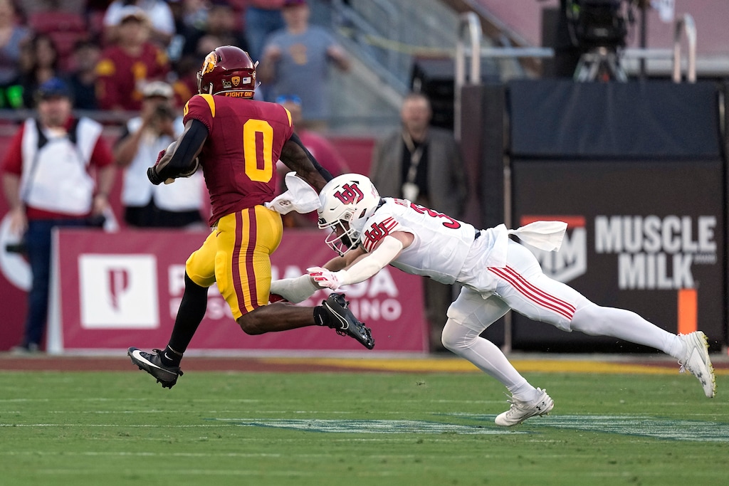 (Mark J. Terrill | The Associated Press) Utah safety Nate Ritchie, right, going for a tackle against USC running back MarShawn Lloyd, is a candidate to move into the starting lineup, or at least get a significant bump in his snap count, if Sione Vaki becomes a primarily offensive player going forward.