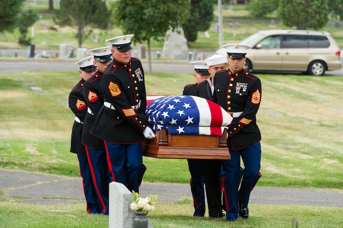 (Alex Gallivan  |  Special to The Tribune) Marine Pfc. Robert K. Holmes, who died 77 years ago aboard the USS Oklahoma during the attack on Pearl Harbor, is laid to rest in the Salt Lake City Cemetery, Monday, Aug. 20, 2018.