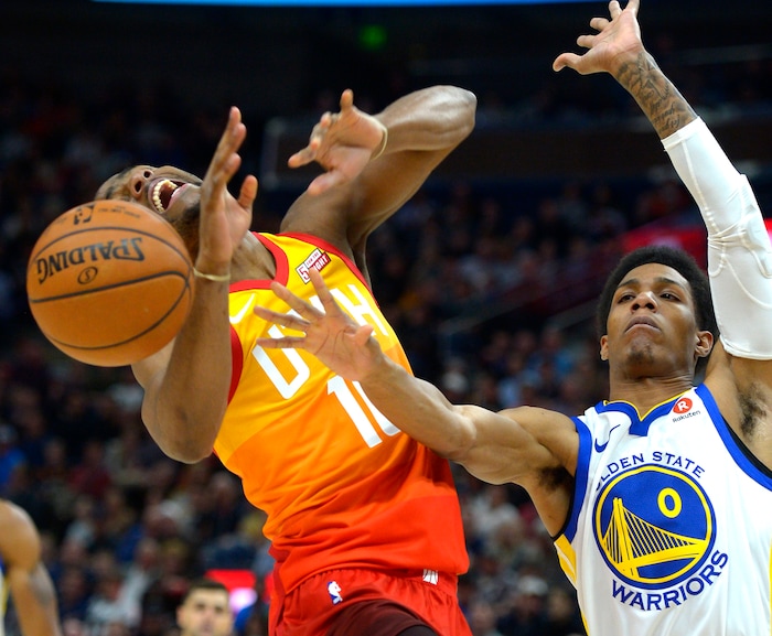 (Steve Griffin  |  The Salt Lake Tribune) Utah Jazz guard Alec Burks (10) gets fouled by Golden State Warriors guard Patrick McCaw (0) during the Utah Jazz versus Golden State Warriors at Vivint Smart Home Arena in Salt Lake City Tuesday January 30, 2018.
